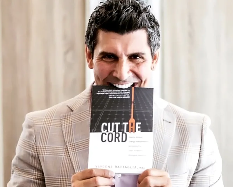 Vincent Battaglia holding the Cut the Cord book